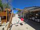 Backyard with swing set, playhouse, and covered patio provides a fun and shaded outdoor space at 4823 El Tesoro Ave, Las Vegas, NV 89121