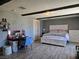 Bedroom featuring a bed, vanity, dresser and wood-look floors at 4823 El Tesoro Ave, Las Vegas, NV 89121