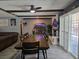Dining room showcases a large dining table, with seating for eight and sliding doors to the yard at 4823 El Tesoro Ave, Las Vegas, NV 89121