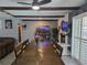 Open dining area with beamed ceiling and large table with seating for eight at 4823 El Tesoro Ave, Las Vegas, NV 89121