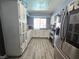 Charming kitchen with updated appliances, white cabinets, and lots of natural light at 4823 El Tesoro Ave, Las Vegas, NV 89121