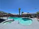 Backyard oasis featuring a sparkling pool with a spa, complemented by lush landscaping at 4823 El Tesoro Ave, Las Vegas, NV 89121