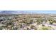 Wide aerial view of the community with houses, golf course, and mountain backdrop at 5221 Crooked River Cir, Las Vegas, NV 89149