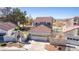 Inviting home boasts a well-manicured lawn, quaint gate, and a charming facade with a two-car garage at 5221 Crooked River Cir, Las Vegas, NV 89149