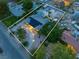 Aerial view of the home showing solar panels, desert landscaping, mature trees, RV parking, and neighborhood at 5486 Alfred Dr, Las Vegas, NV 89108
