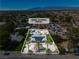Aerial view of the home showcasing its desert landscaping, RV parking, and proximity to mountains at 5486 Alfred Dr, Las Vegas, NV 89108