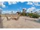 Spacious backyard featuring gravel landscaping and outdoor seating area with a fire pit at 5486 Alfred Dr, Las Vegas, NV 89108