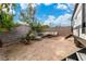 Backyard patio area with gravel, outdoor seating, and parked trailer at 5486 Alfred Dr, Las Vegas, NV 89108