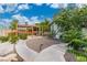Backyard space with a wooden structure, gravel area and lush greenery at 5486 Alfred Dr, Las Vegas, NV 89108