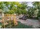 Backyard includes artificial grass, playset with climbing wall, and outdoor lounge chair at 5486 Alfred Dr, Las Vegas, NV 89108
