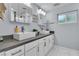 Contemporary bathroom with double vanity, stylish fixtures, and ample storage offers a modern look at 5486 Alfred Dr, Las Vegas, NV 89108