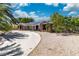 Beautiful single-story home with desert landscaping and a spacious driveway in daytime at 5486 Alfred Dr, Las Vegas, NV 89108