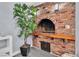 Rustic brick fireplace with a wooden mantel adds character to the interior space and includes a lower storage area at 5486 Alfred Dr, Las Vegas, NV 89108