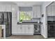 Kitchen featuring stainless appliances, white cabinets, and beverage refrigerator at 5486 Alfred Dr, Las Vegas, NV 89108