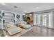Modern living room features a white plush seating, fireplace, and French doors at 5486 Alfred Dr, Las Vegas, NV 89108