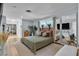 Calming main bedroom with soft colors, natural light, and stylish decor, with hardwood floors and a large mirror at 5486 Alfred Dr, Las Vegas, NV 89108