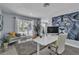 Inviting home office with a window view, comfortable seating, and modern decor at 5486 Alfred Dr, Las Vegas, NV 89108