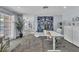 Home office featuring a large window, modern desk, and statement art at 5486 Alfred Dr, Las Vegas, NV 89108