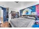 Bedroom with a large closet, blue accent wall, and wood-look flooring throughout at 5612 Royal Castle Ln, Las Vegas, NV 89130