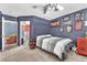 Modest bedroom with painted walls, carpeted floors, and an adjacent room for versatile use at 5612 Royal Castle Ln, Las Vegas, NV 89130