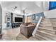 Comfortable living room featuring plush seating, staircase, and ample space for relaxation at 5612 Royal Castle Ln, Las Vegas, NV 89130