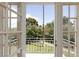 Balcony view of lush landscaping and trees with blue sky and white metal railing in this well-maintained home at 572 Tam O Shanter, Las Vegas, NV 89109