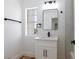 Bright bathroom with vanity, black fixtures, and a window at 572 Tam O Shanter, Las Vegas, NV 89109