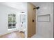 Modern bathroom features a wood accent wall in the walk-in shower and access to the exterior at 572 Tam O Shanter, Las Vegas, NV 89109