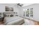 Staged bedroom with a ceiling fan and a french door exit to balcony at 572 Tam O Shanter, Las Vegas, NV 89109