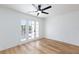 Bedroom with ceiling fan and doors to balcony at 572 Tam O Shanter, Las Vegas, NV 89109