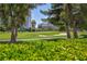 Scenic view of a golf course with sand traps and city buildings in the distance at 572 Tam O Shanter, Las Vegas, NV 89109