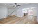Spacious living area featuring modern flooring and an open floor plan leading to the kitchen and dining area at 572 Tam O Shanter, Las Vegas, NV 89109