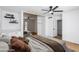 Staged main bedroom with fan, closet, and door to bathroom at 572 Tam O Shanter, Las Vegas, NV 89109