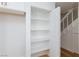 Interior walk-in pantry features white shelving for ample storage at 572 Tam O Shanter, Las Vegas, NV 89109