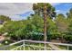 Balcony view overlooking the community pool with abundant shade trees at 572 Tam O Shanter, Las Vegas, NV 89109