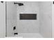 Close-up of marble-look shower surround and black fixtures at 572 Tam O Shanter, Las Vegas, NV 89109
