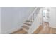Clean, well-lit staircase with white rails, wood treads, and flooring at 572 Tam O Shanter, Las Vegas, NV 89109