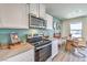 Well-equipped kitchen with modern appliances and a cozy dining nook at 6185 Hibiscus Garden St # 180, North Las Vegas, NV 89081