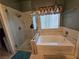 Bathroom with stand up shower and luxurious bathtub provides relaxation at 6363 Berry Patch Way, Las Vegas, NV 89142