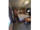 The primary bedroom includes a ceiling fan, carpeted floors, and an attached headboard with storage at 6363 Berry Patch Way, Las Vegas, NV 89142