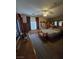 This bedroom features a ceiling fan, large window, and carpeted floors at 6363 Berry Patch Way, Las Vegas, NV 89142