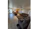 Cozy living room next to an eat-in kitchen with tiled floors at 6363 Berry Patch Way, Las Vegas, NV 89142