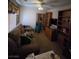 Cozy living room features a plush sofa, mirror closet, and convenient shelving units at 6363 Berry Patch Way, Las Vegas, NV 89142