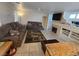 A comfortable living room with a fireplace and mounted television at 6363 Berry Patch Way, Las Vegas, NV 89142