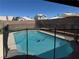 Sparkling backyard pool offering a refreshing escape, enclosed with a safety fence for peace of mind at 6363 Berry Patch Way, Las Vegas, NV 89142