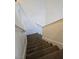 Carpeted staircase with white handrails provides access between floors in this home at 6363 Berry Patch Way, Las Vegas, NV 89142