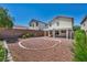 View of the backyard featuring a covered patio and desert landscaping at 6377 W Haleh Ave, Las Vegas, NV 89141