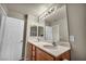 Bathroom with double sink vanity, modern mirror and tiled floors at 6377 W Haleh Ave, Las Vegas, NV 89141