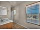 Bathroom showcasing a vanity with a sink and a shower with a tub at 6377 W Haleh Ave, Las Vegas, NV 89141
