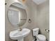 Powder room showcasing a pedestal sink and elongated toilet at 6377 W Haleh Ave, Las Vegas, NV 89141